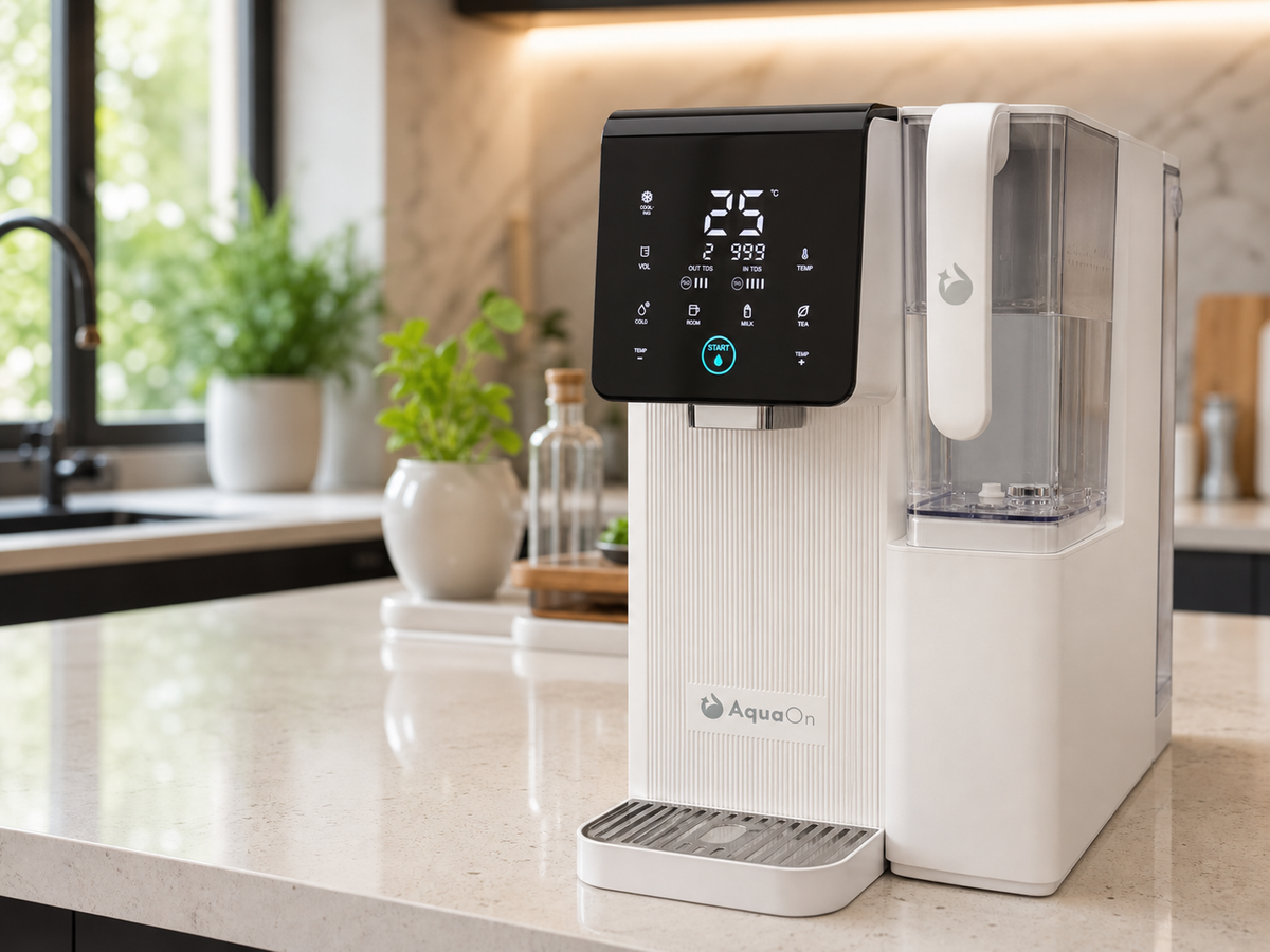 Aquaon Aq100 countertop water purifier on a kitchen counter with digital display