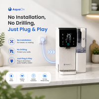 Aquaon Aq100 countertop water filter on a kitchen counter with branding and features highlighted.